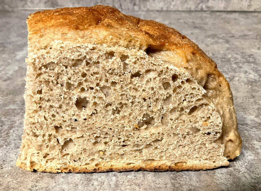 Whole spelt sourdough bread crumb showing open, tender texture